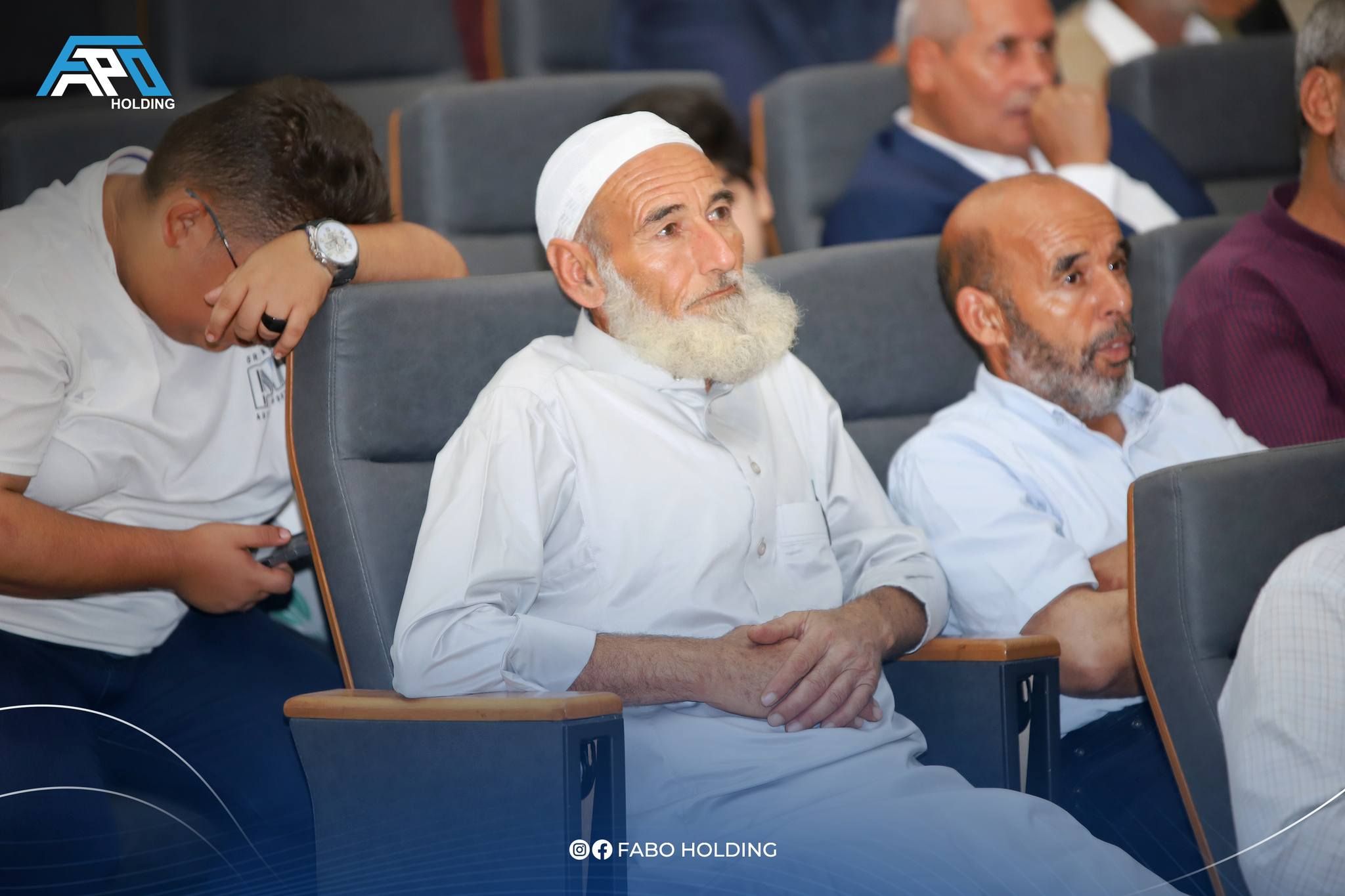 old man set chair in fapo holding event